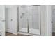 Bathroom featuring tiled standing shower with glass door and chrome hardware at 3813 Rosebush Dr, Zebulon, NC 27597