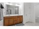 Bathroom featuring double vanity and bright white trim at 479 Clark Creek Ln, Cary, NC 27519