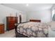 Spacious bedroom with dark furniture and overhead lighting at 479 Clark Creek Ln, Cary, NC 27519
