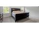 Bedroom with a large bed and natural light at 479 Clark Creek Ln, Cary, NC 27519