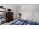 Bedroom features a dresser, shelving unit, carpet flooring and a view into the living room space at 479 Clark Creek Ln, Cary, NC 27519
