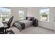 Modern bedroom with dual windows, carpet, desk, chair and minimalist decor at 479 Clark Creek Ln, Cary, NC 27519