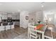 Bright dining area flows into the kitchen, complete with a wooden table and chair set at 479 Clark Creek Ln, Cary, NC 27519