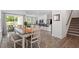 Open-concept dining area with access to outdoor patio at 479 Clark Creek Ln, Cary, NC 27519