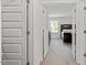 Hallway view showcasing bedroom doors and neutral carpet at 479 Clark Creek Ln, Cary, NC 27519