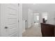 Hallway featuring carpet and access to bedroom and office space at 479 Clark Creek Ln, Cary, NC 27519