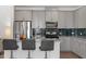 Stylish kitchen boasts stainless steel appliances, granite countertops, and a sleek backsplash at 479 Clark Creek Ln, Cary, NC 27519