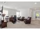 Comfortable living room with a work space, dark carpet, and natural light at 479 Clark Creek Ln, Cary, NC 27519