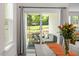 View of a covered patio from the dining table, with a well-manicured lawn at 479 Clark Creek Ln, Cary, NC 27519