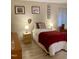 Comfortable bedroom with hardwood floors, soft lighting, and tasteful artwork at 500 Umstead Dr # D307, Chapel Hill, NC 27516