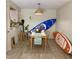 Cozy dining room, with unique wall decor and surfboards, for a fun space at 500 Umstead Dr # D307, Chapel Hill, NC 27516