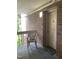 Apartment building brick entryway with chair and 