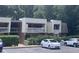 Well-maintained condo building with lush greenery and convenient visitor parking at 500 Umstead Dr # D307, Chapel Hill, NC 27516