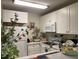 Well-lit kitchen with white cabinetry, modern appliances, and a sink with nice countertops at 500 Umstead Dr # D307, Chapel Hill, NC 27516