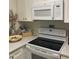 Bright kitchen featuring updated appliances and stylish countertop decor at 500 Umstead Dr # D307, Chapel Hill, NC 27516