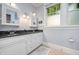 Elegant bathroom with double sinks, granite counters, and bright natural light at 513 Cutler St, Raleigh, NC 27603