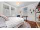 Serene bedroom with natural light, a comfortable bed, and stylish decor at 513 Cutler St, Raleigh, NC 27603