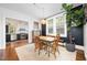 Charming dining room featuring a wooden table, natural light, and a modern light fixture at 513 Cutler St, Raleigh, NC 27603