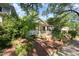 Quaint home featuring a brick staircase leading up to a covered porch with curtains for added privacy at 513 Cutler St, Raleigh, NC 27603
