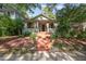 Charming home featuring a brick staircase leading to a cozy front porch with hanging curtains at 513 Cutler St, Raleigh, NC 27603