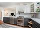 Well-lit kitchen featuring white cabinets, stainless steel appliances, and marble countertops at 513 Cutler St, Raleigh, NC 27603