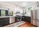 Modern kitchen with stainless steel appliances, two-tone cabinetry, and an open layout at 513 Cutler St, Raleigh, NC 27603