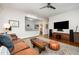 Spacious living room featuring a large TV and comfortable seating at 513 Cutler St, Raleigh, NC 27603