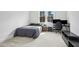 Comfortable bedroom with a black bed set, a desk with monitors, and a gaming chair at 5148 Glen Creek Trl, Garner, NC 27529