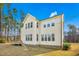 Rear view of the home with multiple windows, siding, and spacious backyard at 5148 Glen Creek Trl, Garner, NC 27529