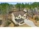 Aerial view of a beautiful two-story home with a well-manicured lawn and surrounding trees at 5148 Glen Creek Trl, Garner, NC 27529