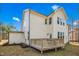 Exterior view of the rear of the home with a deck, siding, and manicured lawn at 5148 Glen Creek Trl, Garner, NC 27529
