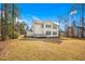 Exterior rear view of the home with a deck, siding, and expansive backyard at 5148 Glen Creek Trl, Garner, NC 27529