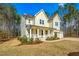 Charming home with a cozy front porch, manicured landscaping, and inviting curb appeal at 5148 Glen Creek Trl, Garner, NC 27529