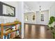 Inviting foyer with hardwood floors and decorative shelving, leading to the living and dining areas at 5148 Glen Creek Trl, Garner, NC 27529