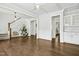 Spacious foyer with hardwood floors and staircase leading to a living space and kitchen at 5148 Glen Creek Trl, Garner, NC 27529