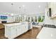 Beautiful kitchen featuring an island and stainless appliances adjacent to the dining and living areas at 5148 Glen Creek Trl, Garner, NC 27529