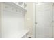 Functional mudroom featuring a bench, hooks, and storage space at 5148 Glen Creek Trl, Garner, NC 27529