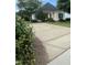 The property includes a paved driveway and lush lawn, enhanced by mature trees and landscaping at 526 Cardena School Rd, Fuquay Varina, NC 27526