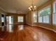 Bright living room with hardwood floors, a chandelier, and multiple windows at 526 Cardena School Rd, Fuquay Varina, NC 27526
