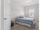 Neutral bedroom with a single bed, carpet, and natural light from the window at 534 Lionheart Ln, Sanford, NC 27330