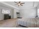 Spacious main bedroom with ceiling fan, carpet, recessed lighting, television, and exercise equipment at 534 Lionheart Ln, Sanford, NC 27330
