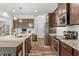 Modern kitchen with sleek stainless appliances, granite countertops, and ample storage, perfect for culinary enthusiasts at 534 Lionheart Ln, Sanford, NC 27330
