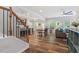 Open-concept living space with hardwood floors, flowing seamlessly into the kitchen and dining areas at 534 Lionheart Ln, Sanford, NC 27330