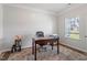 Cozy home office with natural light, featuring hardwood floors and a comfortable workspace at 534 Lionheart Ln, Sanford, NC 27330