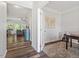 Bright office featuring hardwood floors, a large window, and a view into the open-concept living area at 534 Lionheart Ln, Sanford, NC 27330