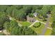 Idyllic aerial perspective highlighting a two-story home set amidst lush greenery and a private lot at 55 Fleming Forest Dr, Youngsville, NC 27596
