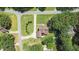 Picturesque aerial view of a home with a long driveway, landscaped yard, and mature trees at 55 Fleming Forest Dr, Youngsville, NC 27596