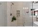 This bathroom has an elegant glass shower, bench, and plant at 55 Fleming Forest Dr, Youngsville, NC 27596