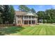Elegant two-story home with a welcoming double porch and well-manicured front lawn at 55 Fleming Forest Dr, Youngsville, NC 27596