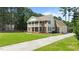 Charming two-story home with brick and siding, double balconies, and lush green lawn at 55 Fleming Forest Dr, Youngsville, NC 27596